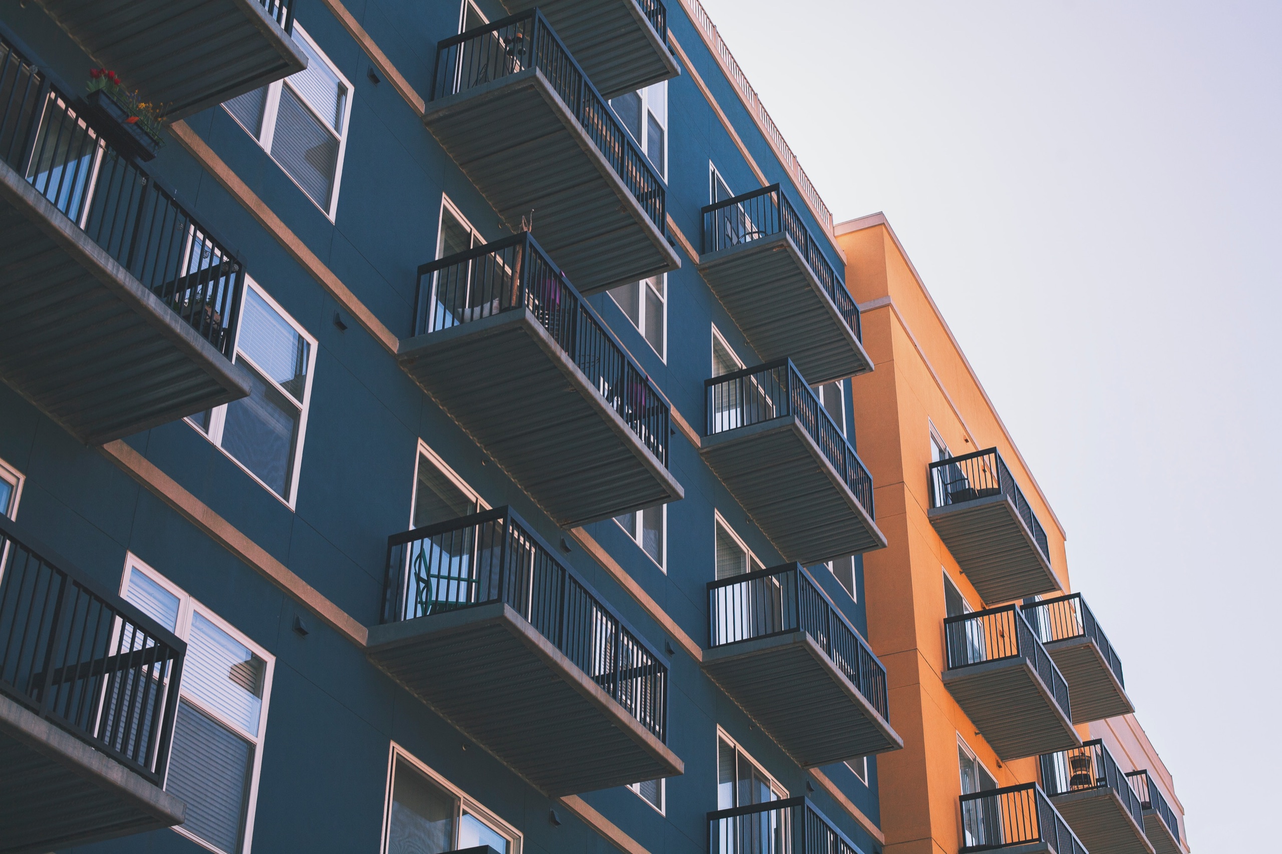 TotalMed’s Housing Department Is Here To Help All Travelers low angle view of blue and orange apartments