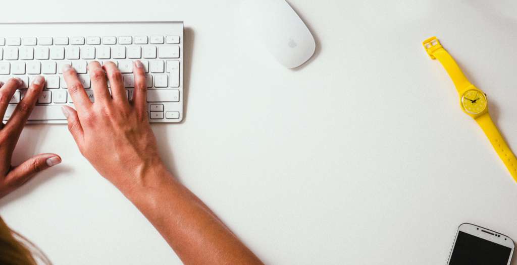 Meet TotalMed’s Quality Assurance Team typing on a keyboard