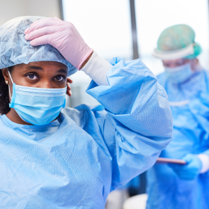 Two nurses in scrubs.